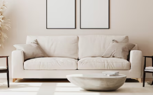 Minimalist living room with a beige sofa and chairs