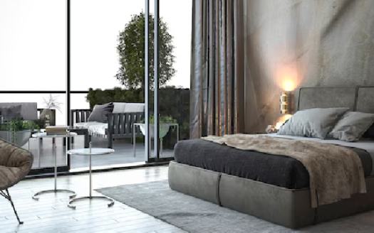 Modern bedroom with floor-to-ceiling windows and a cozy outdoor terrace.